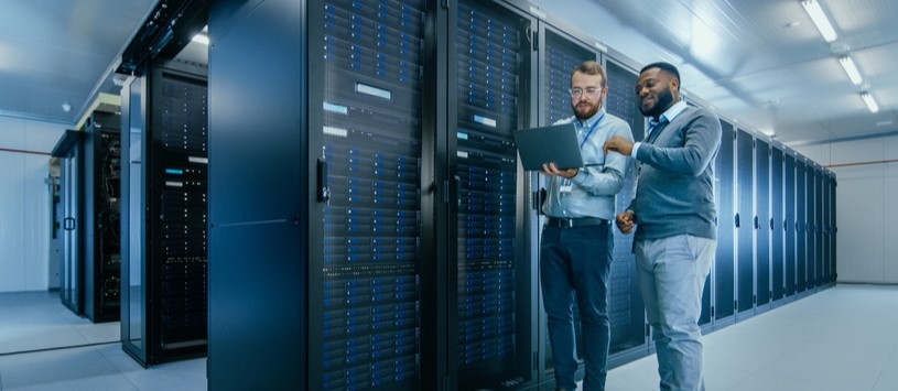 Computer Network Administration professionals in an IT server room.