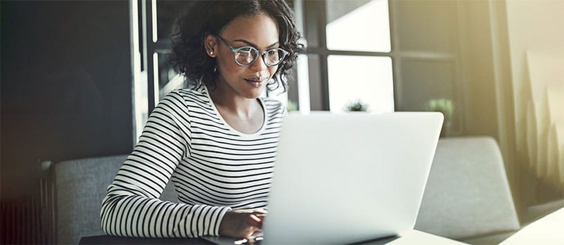 Interactive Digital Media and Marketing professional using her laptop for work.