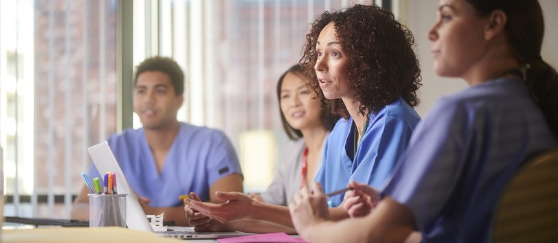 Health Information Management professionals in a workplace setting.