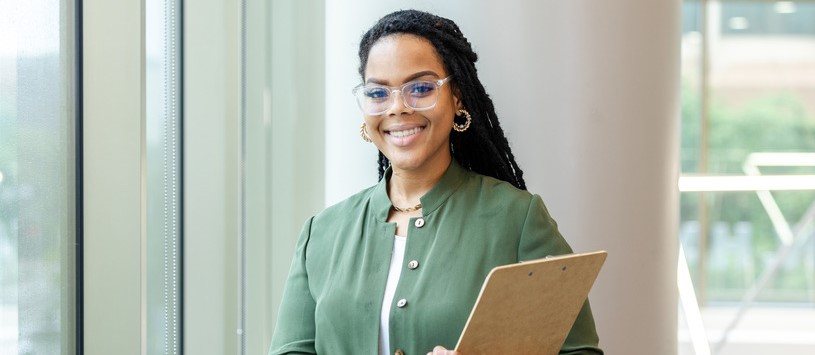 Human Services professional holding a clipboard.