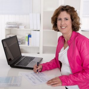 An Office Assistant working at her desk